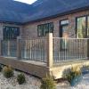 Clean, contemporary steel railing, powder coated and installed between wooden posts with no exposed fasteners