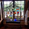 Custom wrought iron displahy stand for student made stained glass at College of the Ozarks