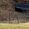 Custom wrought iron fencing built and staggered to sloping lay of the land.