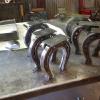 1/4" and 1/8" plate fabricated horseshoes, that will serve as legs, for long, custom, heavy timber benches. 