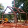 Completed heavy wall steel tubing "Cloud House" frame. An art project, the large column and plate, at top center of ridge, will support a 2000# fiberglass "cloud", plumbed to make rain on what is to be a tin roof.