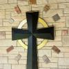 Hammered brass and steel cross, surrounded by embedded pieces of brick from a 15th century English church.