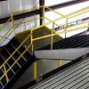 metal industrial stairs, 90 degree turn, with welded handrail and intermediate platform, panned for 2" concrete fill, built and installed by CHR Metals