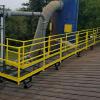 42 ft. long access catwalk, on a pitched roof, from a penthouse door, to an industrial filter unit