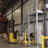 Galvanized steel stairs, landing, handrails, and fork truck gate, for access to new 2nd floor office space, in a grocery distribution warehouse