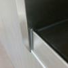 close-up of fit and finish ob stainless wall opening