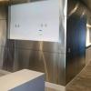 Decorative stainless steel wall panels with small reveal between sheets, at an architectural design firm